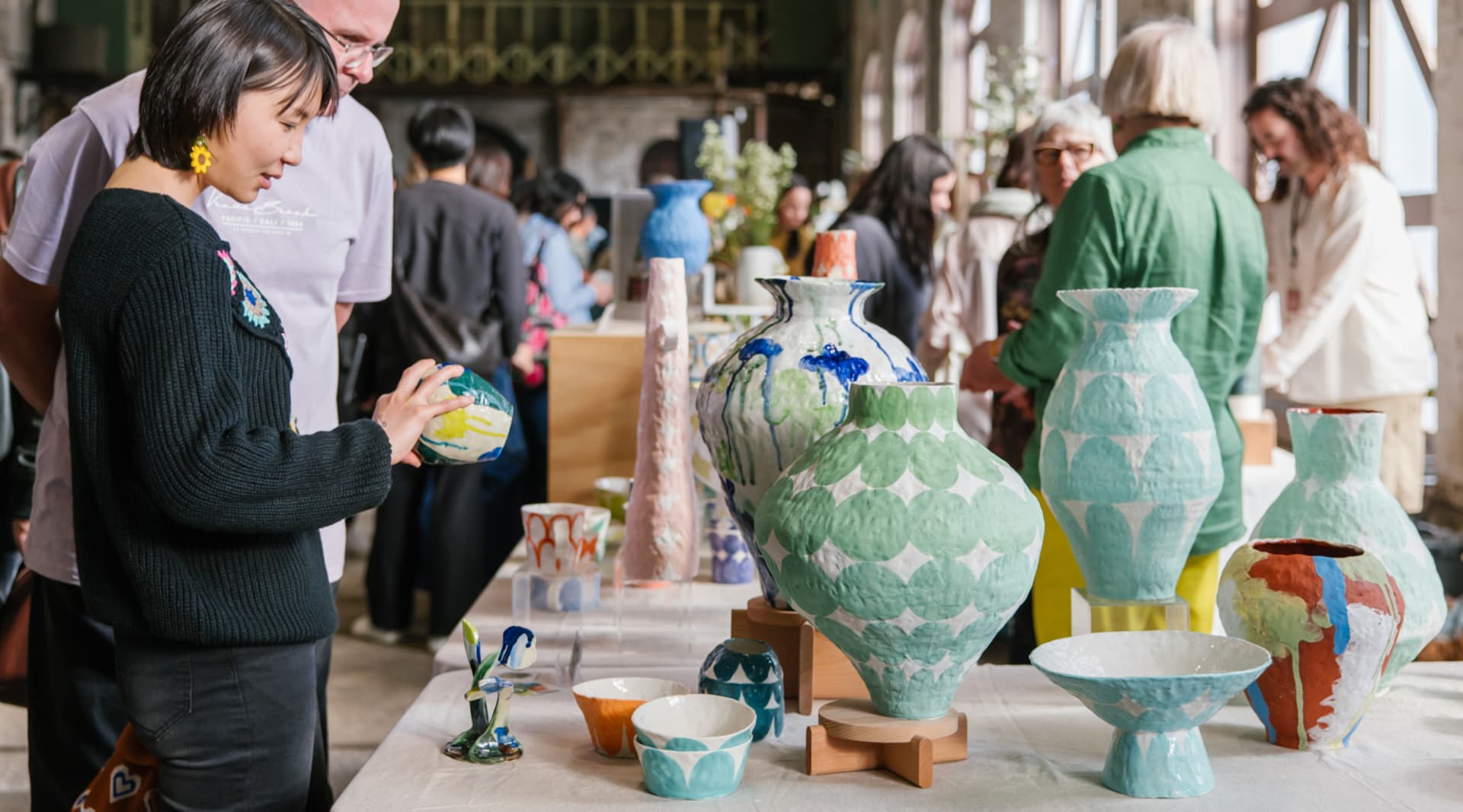 Sculptural ceramic works of Albatross Ceramic and ceramic vases with earthy hand-painted details by Trade The Markon display at Sydney Ceramics Market 2023, photos: Amy Piddington.